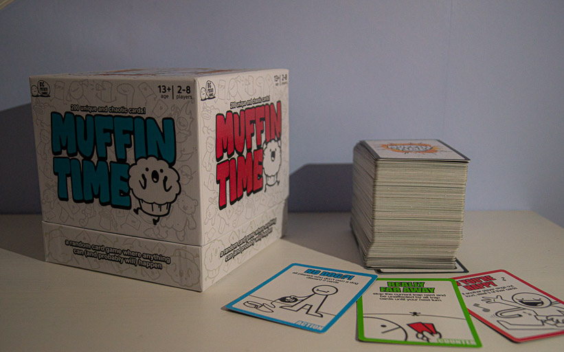 The muffin time box next to a stack of cards